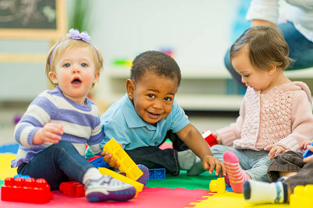 Diverse group of babies playing. Diverse group of babies playing.